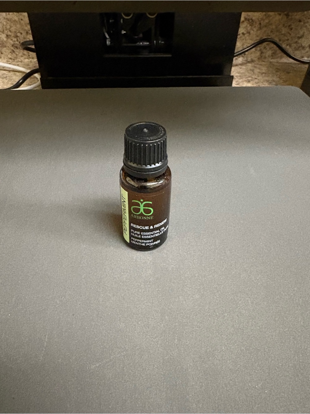 Arbonne Essential Oil Bottle with Green Label